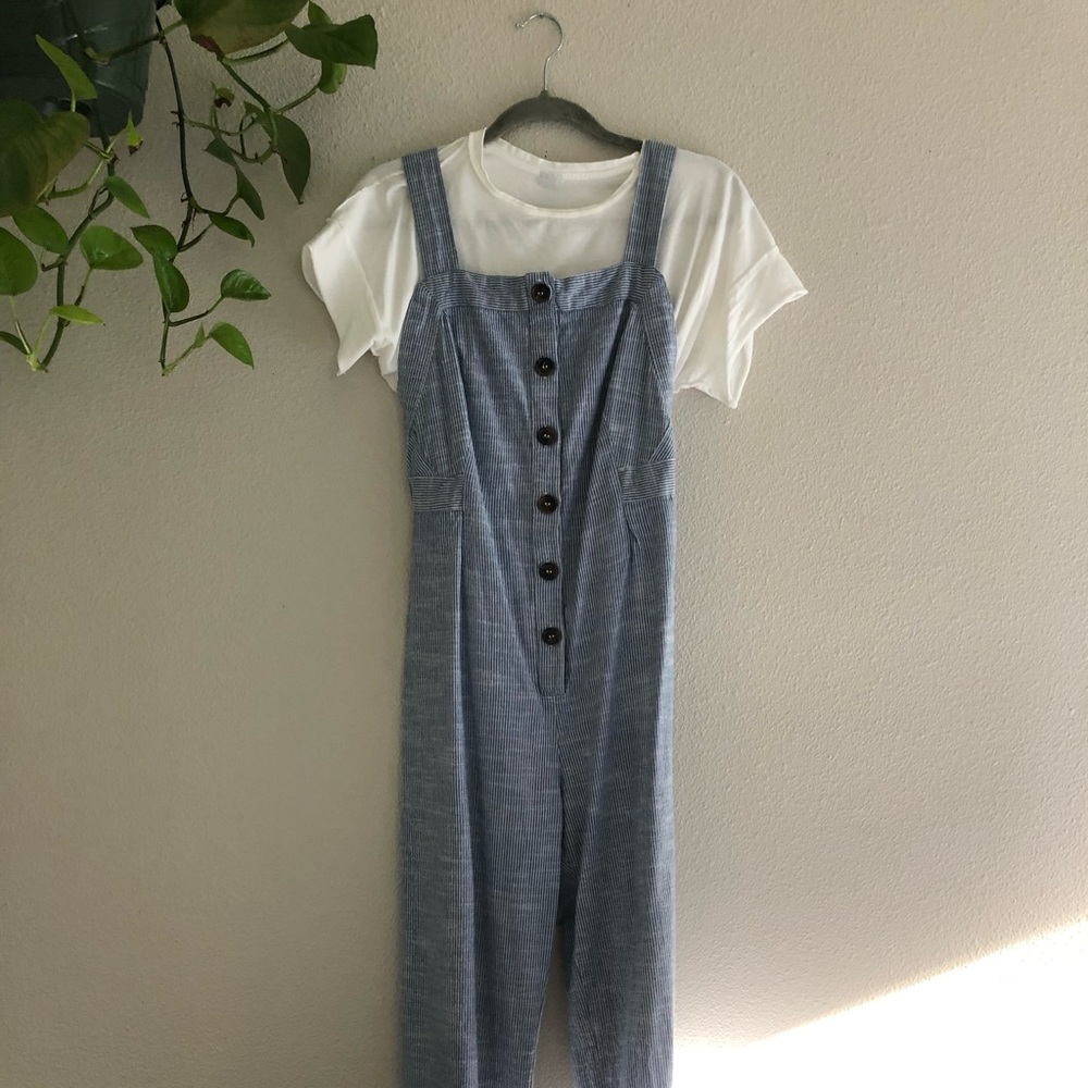 Button down, open back overalls.